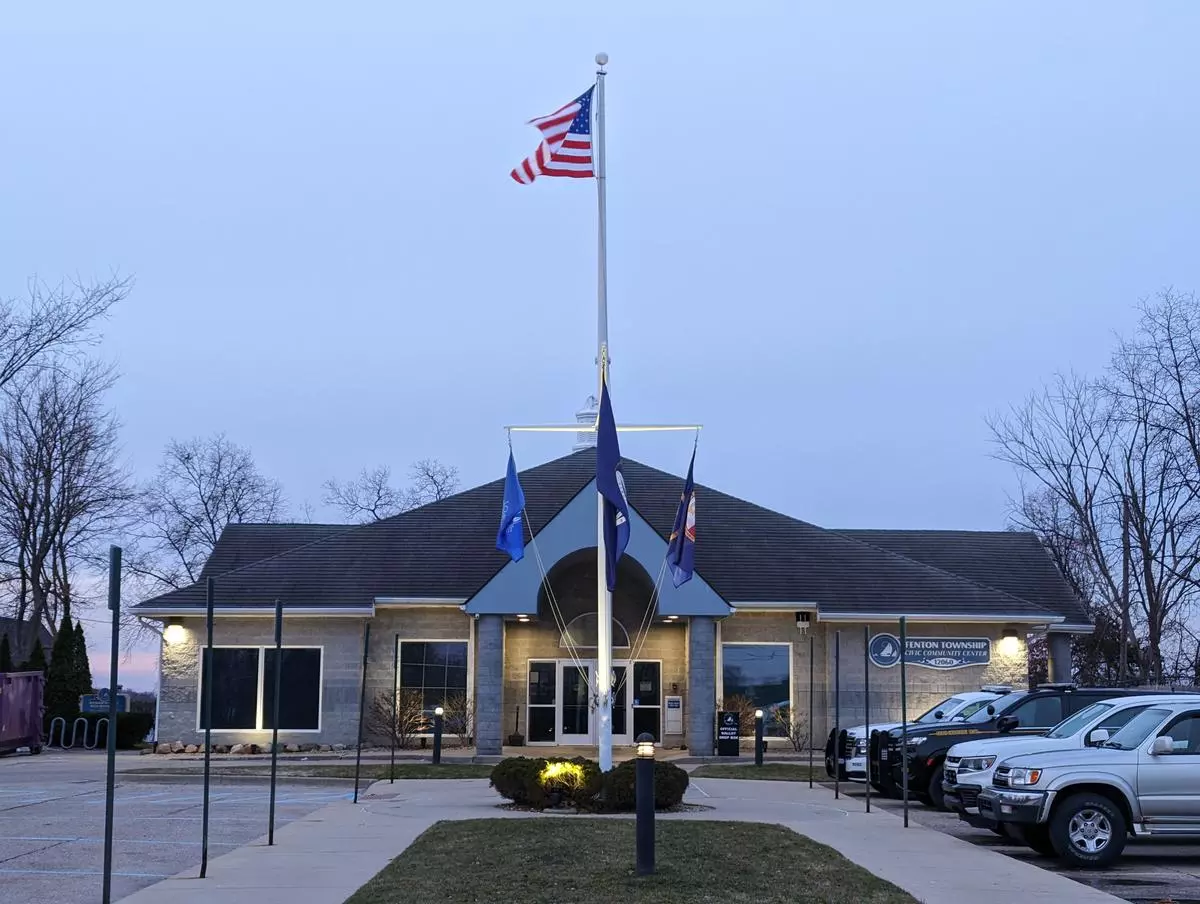Fenton Township Civic Community Center with gray sky at sunrise