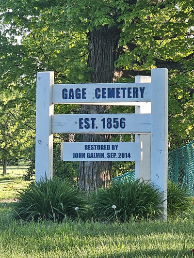 a sign that says Gabe Cemetery established 1856 restored by John Galvin September 2014 