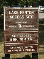 Brown wooden Michigan DNR sign that reads "Lake Fenton Access Site" 