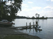 Picture is mostly of the water from Lake Ponemah but showcases the boat launch slope from the left to the right into the water.