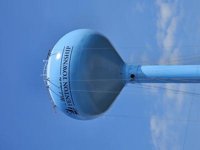 Top of water tower now painted blue with the welcome to Fenton Township logo in black